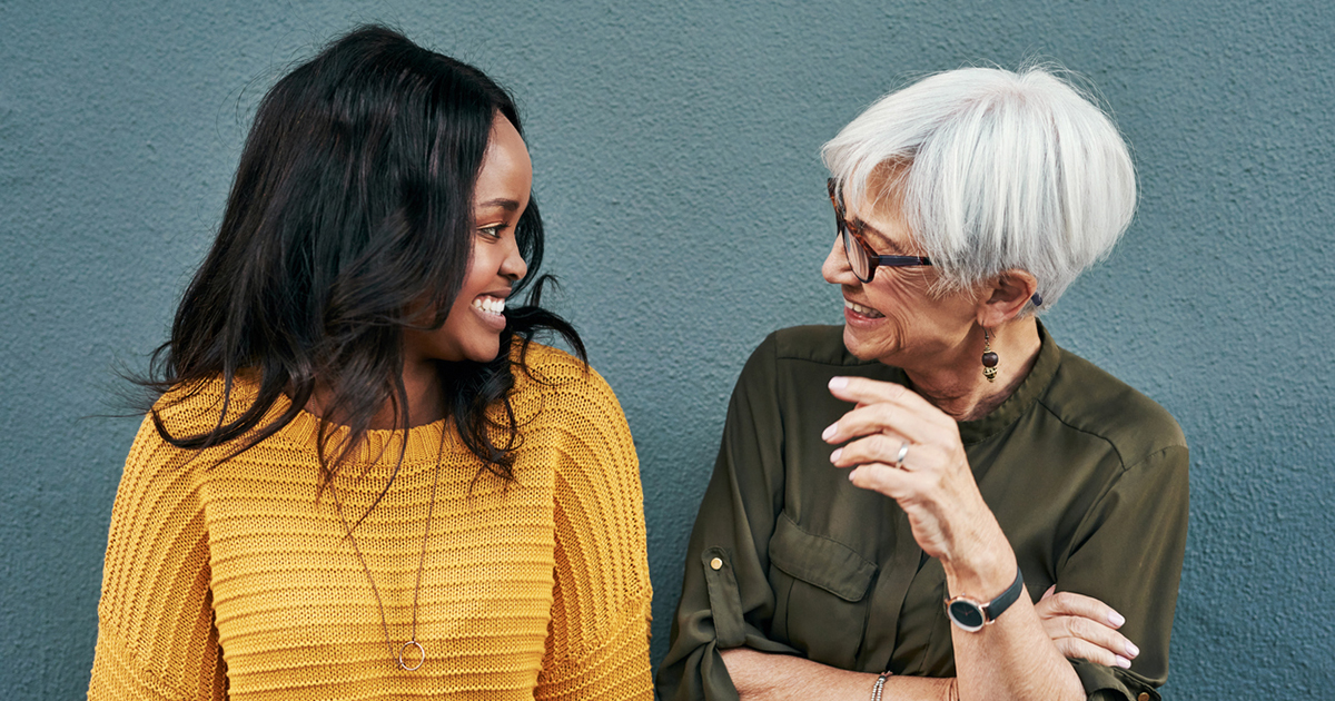 Two women talking and laughing