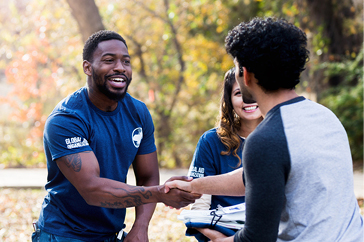 volunteers shaking hands